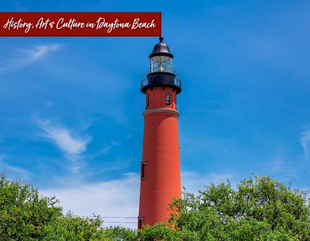 A red lighthouse stands tall against a blue sky with text reading 