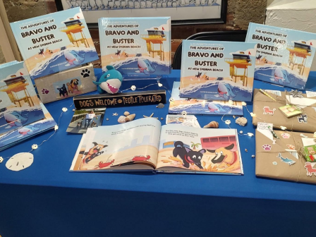 The table features a display of children's books titled 