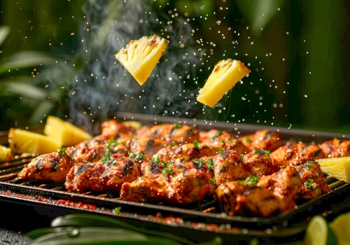 Grilled chicken skewers garnished with herbs, and two pieces of pineapple being sprinkled over the grill, with a smoky background.